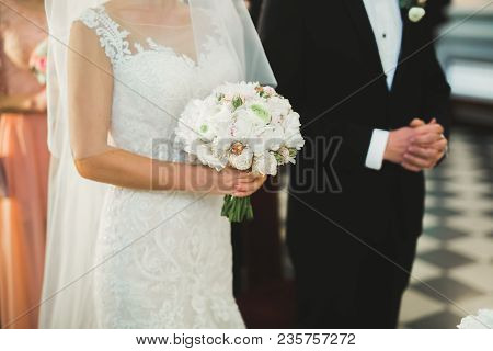 Wedding Couple Bide And Groom Get Married In A Church.