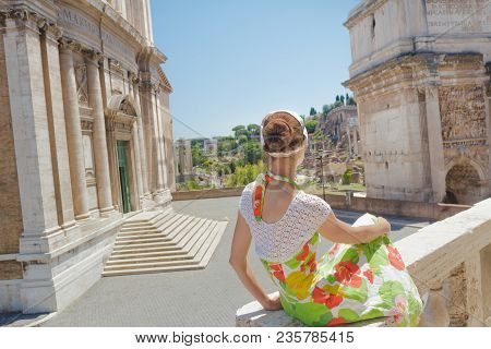 Pretty Woman In Floral Dress On Tourist Viewpoint Looking At View Of Palatine Hill On Roman Forum An