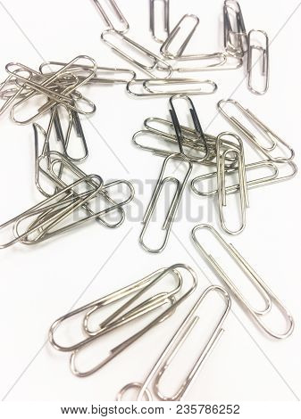 Office Tool. Paper Clip On The White Background-office Tool.