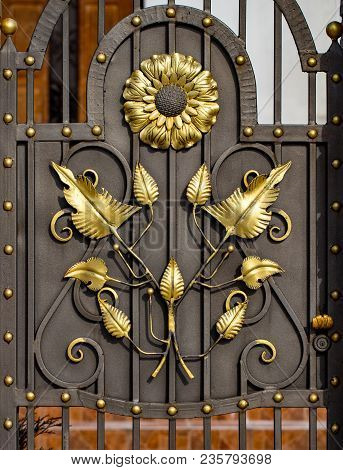 Details, Structure And Ornaments Of Forged Iron Gate. Floral Decorative Ornament, Made From Metal. V