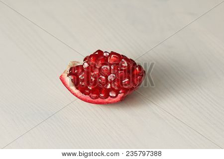 Big Ripe Red Granets Or Garnets. Fruits Of Red Ripe Pomegranate On The White Background. Vegetarian 