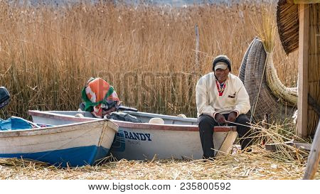 Puno, Peru - September 2017: Unidentified Man At The Floating Island Isla Flotante, Titicaca Lake, P