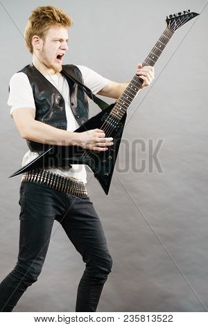 Young Man Playing Electric Guitar