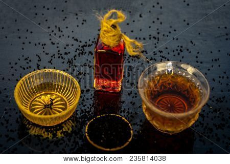 Close Up Of Ayurvedic Treatment Consisting Of Kalonji, Roman Coriander With Honey, Black Tea And Its
