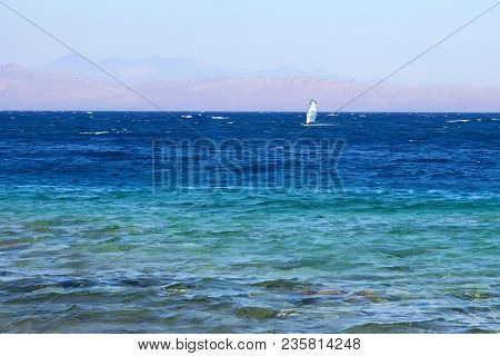 View Of Beautiful Waters Of Red Sea And Windsurfer In Distance