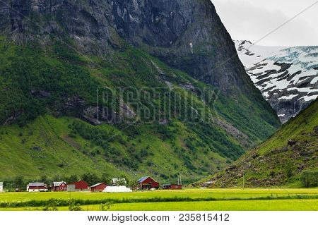 Tourism Vacation And Travel. Mountains Landscape At Summer With Beautiful Grren Valley, Stryn Munici