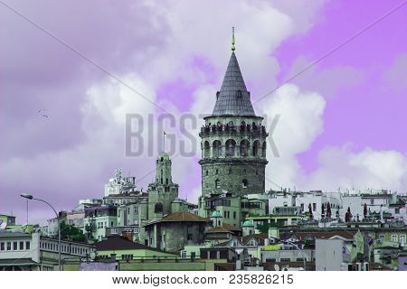 Frontal View Of Galata Tower And Cityscape Of Istanbul With A Purple Filter Applied.