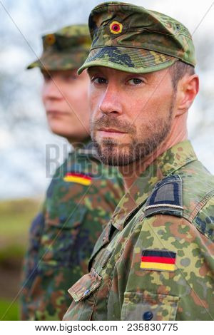 Two German Soldiers Looks To The Side