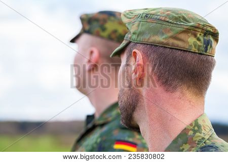 Two German Soldiers Looks To The Side