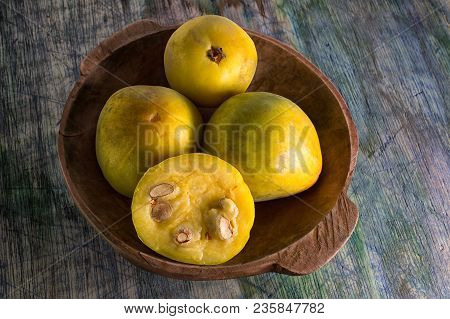 Rare Araza Fruits In A Wooden Bowl On Rustic Background