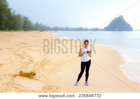 Woman Relax Morning With Dog On Beach At Bang Beot Beach, Chumphon Province Thailand