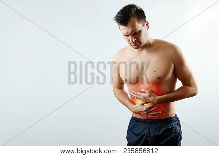Front View, The Man Holds His Hands To The Stomach, Abdominal Pain, Pain In The Stomach Highlighted