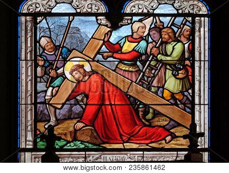 PARIS, FRANCE - JANUARY 10: 3rd Stations of the Cross, Jesus falls the first time, stained glass window in the Saint Eugene - Saint Cecilia Church, Paris, France on January 10, 2018.