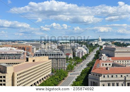 Washington D.C. - An aerial view of Pennsylvania Avenue with federal buildings including US Archives building, Department of Justice, FBI Headquarters and US Capitol Hill