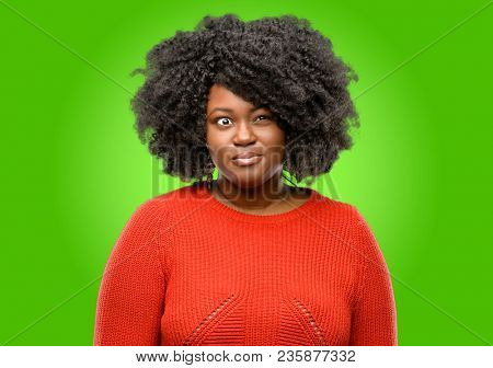 Beautiful african woman making funny face fooling