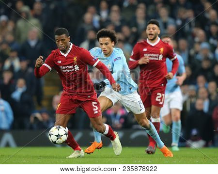 MANCHESTER, ENGLAND - APRIL 10: Georginio Wijnaldum   and Leroy Sane  during the Champions League quarter final match between Manchester City and Liverpool at the Etihad Stadium on April 10, 2018 