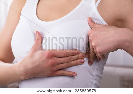 Close-up Of A Woman's Hand On Breast