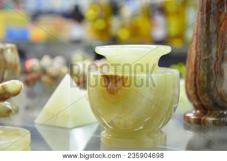 A Small Vase Of Natural Onyx With Orange And Green Pattern On The Stone. Candlestick.