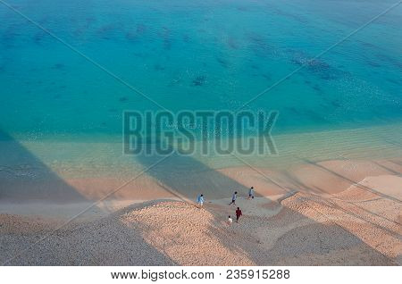 Several People On The Beach Of Kouki In Nago On Okinawa Island In Japan. Beautiful Turquoise Water C