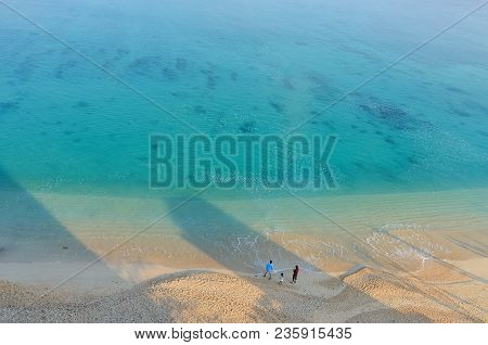 Several People On The Beach Of Kouki In Nago On Okinawa Island In Japan. Beautiful Turquoise Water C