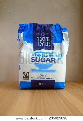 Bracknell, England - April 13, 2018: Part Consumed One Kilo Bag Of Tate & Lyle Granulated Sugar On A