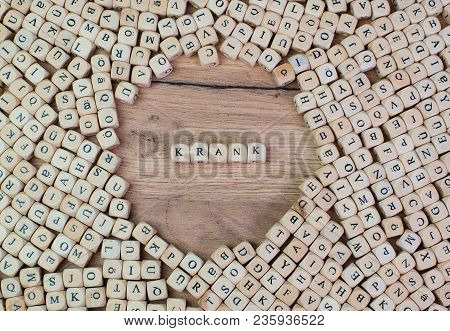 Krank, German Text For Sick, Word In Letters On Cube Dices On Table