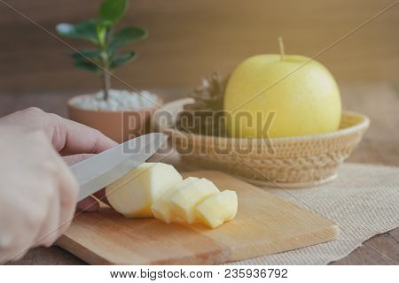 Woman Use Knife Kitchen To Chopped Or Cut Shinano Gold Apple. Sliced Fresh Shinano Gold Apple On Woo