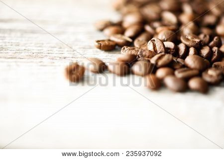 Coffee Beans On Light Wooden Background With Copyspace For Text. Coffee Background, Food Frame, Text