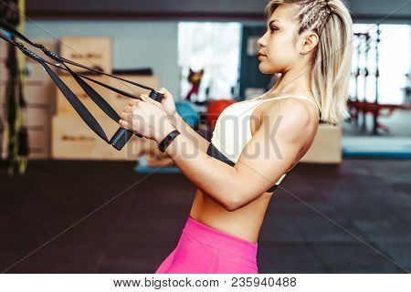 Beautiful Woman Is Doing Exercises In The Sport Club.