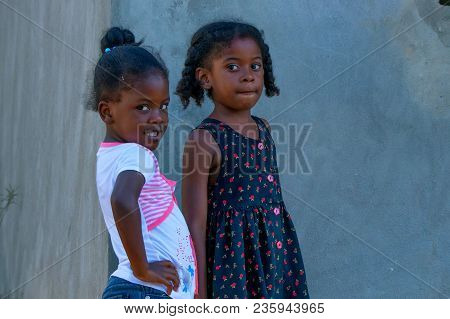 Higuey, Dominican Republic - October 29, 2015: Portrait Of Two Small Unidentified Dominican Girls Ou