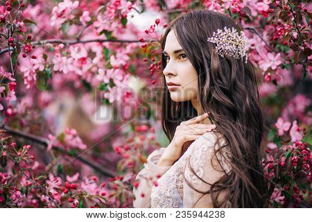 Beautiful Cute Girl Bride In Boudoir Lace Transparent Dress, With Decoration On The Hair, Near The T