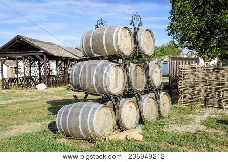 Russia, Ataman - 26 September 2015: Stacked Wine Barrels. Decoration Of The Barrels In The Village A