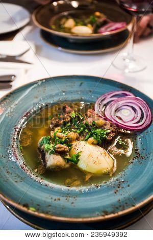 Caucasian Soup Putuk (piti) From Mutton Brisket, Chick Peas, Potatoes In Plate On Table