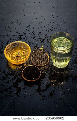 Close Up Of Kalonji Or Roman Coriander With Water And Honey On Wooden Surface Beneficial For Diabete