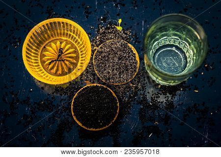 Close Up Of Kalonji Or Roman Coriander With Water And Honey On Wooden Surface Beneficial For Diabete