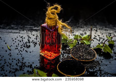 Close Up Of Kalonji, Roman Coriander, Mint Leaves, And Powder Of Kalonji With Its Extracted Oil For