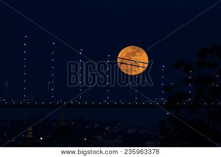 Super Blue Blood Moon Behind Bosphorus Bridge In Istanbul City, Turkey