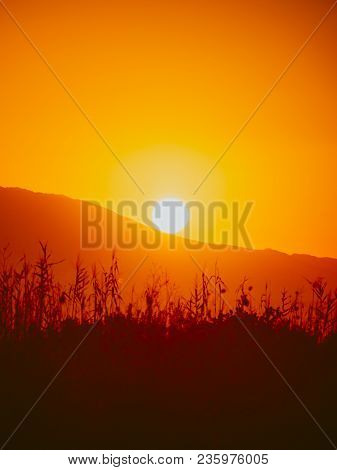 Scenic Sunset Or Sunrise Sun Rising Over Mountain Hill