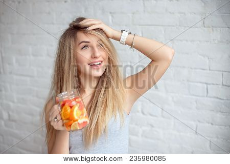 Close-up Happy Woman With Glass Of Fresh Summer Lemonade With Straw. Caucasian Young Girl 20-25 Year