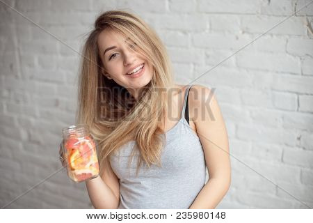 Close-up Happy Woman With Glass Of Fresh Summer Lemonade With Straw. Caucasian Young Girl 20-25 Year