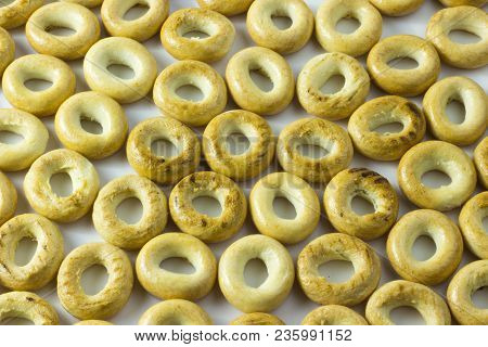 Small Bagels Or Small Rolls On A White Background.