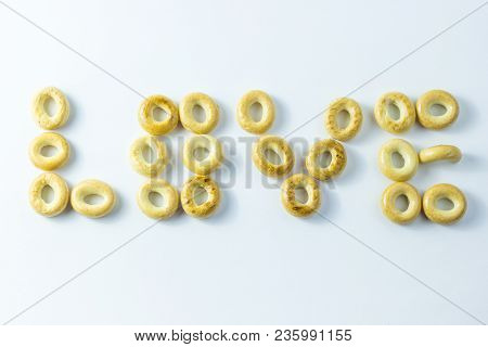 A Word Of Love Made From Small Rolls On A White Background.