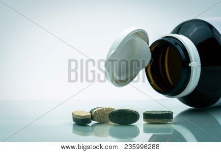 Essential Vitamins And Minerals Supplements Dual Layer Tablet Pills And Medicine Glass Bottle With O