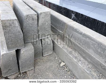 Piled Concrete Curbstones. Construction Material For Road Construction Works