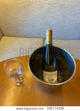 Ft. Lauderdale, Fl/usa-10/30/19: A Wine Glass And Ice Cold Bucket Of Cupcake Chardonnay Wine Ready T