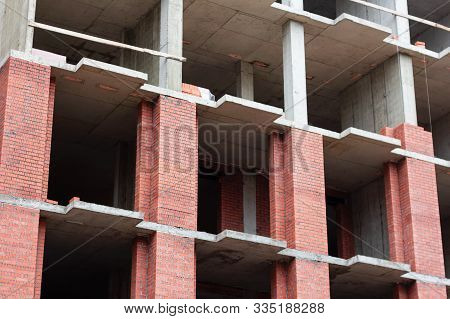 High-rise Brick Building. Construction Structure Developmen Site.