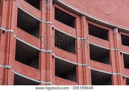 High-rise Brick Building. Construction Structure Developmen Site.