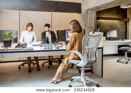 Creative Office Employees Making Interior Design On The Computers, Sitting At The Modern Office Of A