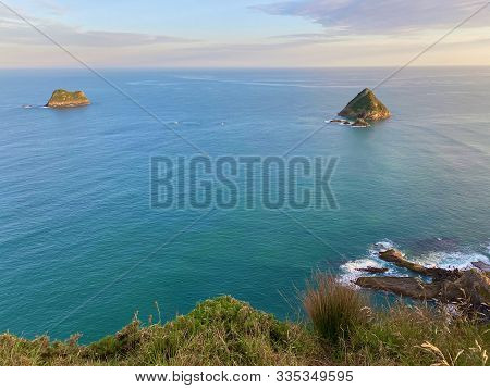 Sunrise On The Taranaki Coast Towards Moturoa Island And Tokomapuna Island From New Plymouth