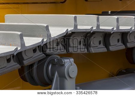 Caterpillars Metal Parts Of The Excavator Shot Close-up.